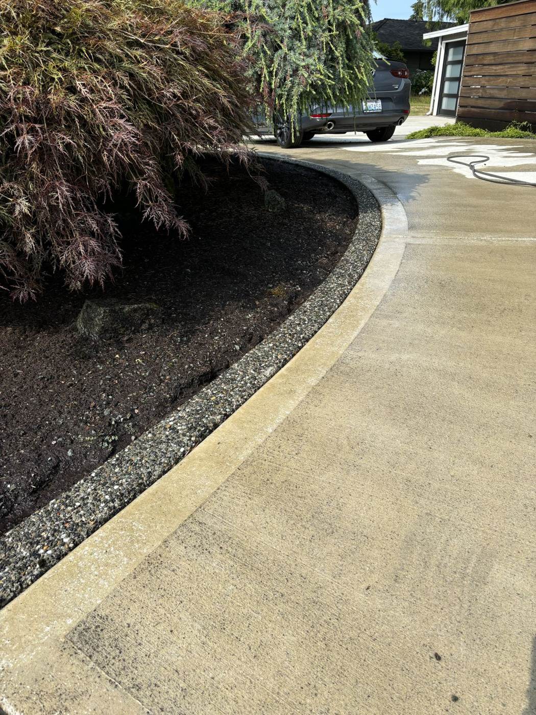 Clean stone patio after power washing, second angle